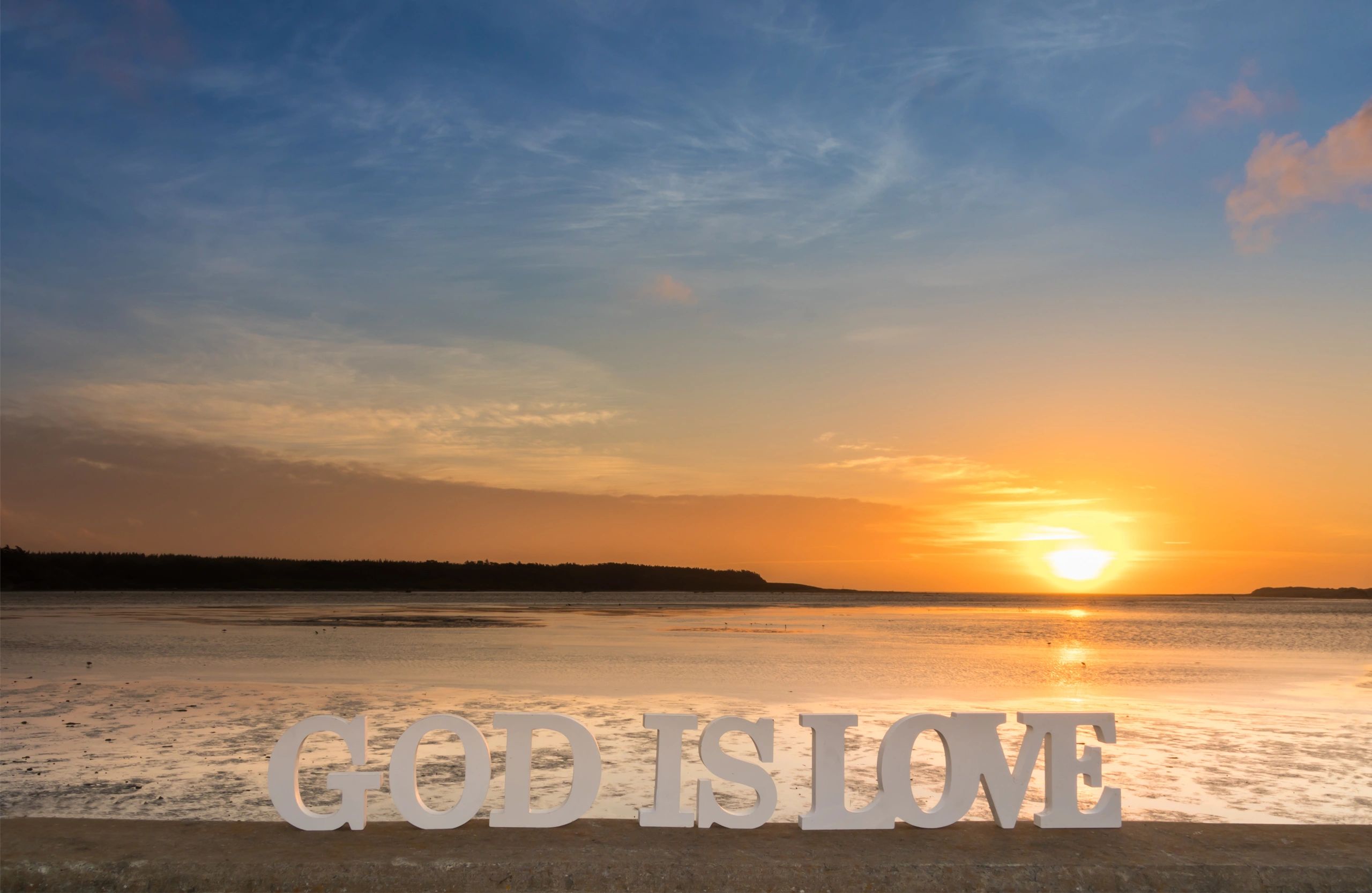 3D words saying 'God is love' as the